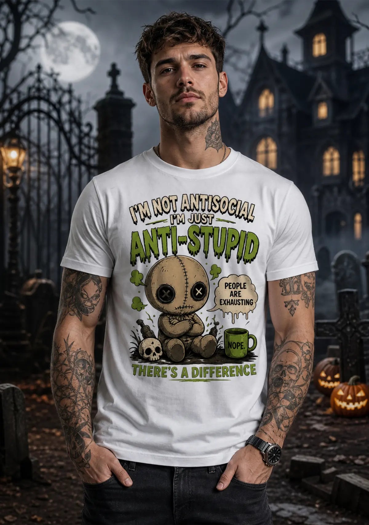 Person wearing a chibi voodoo doll anti‑stupid T‑shirt in a spooky Halloween setting with pumpkins and a gothic building