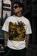 A person wearing a treasure‑heist cartoon tee stands on a wet cobblestone street with a vintage car, brick buildings and noir night atmosphere.