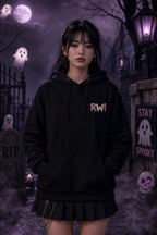 Person in black hoodie and pleated skirt standing in eerie graveyard scene with moon, lantern glow, tombstones and floating ghosts