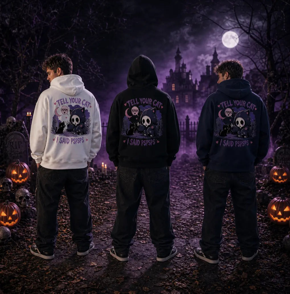 Three people in Halloween forest scene wearing chibi skull‑cat hoodies, standing amid pumpkins, tombstones and purple mist