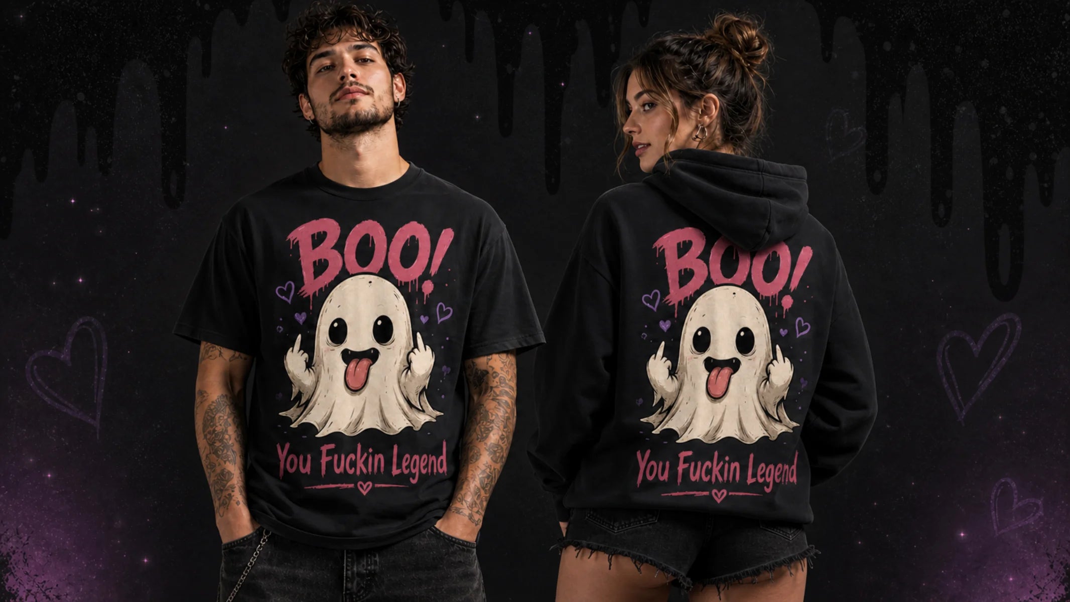 A man and a woman modeling a matching black Halloween graphic shirt and hoodie set. The front and back of the black apparel feature a cute white cartoon ghost with its tongue sticking out, surrounded by pink hearts and the text 'BOO! You Fuckin Legend' in pink and white.