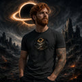 Man with red hair and beard in dark gray tee featuring black hole graphic before ringed cosmic black hole and ruined sci‑fi landscape.