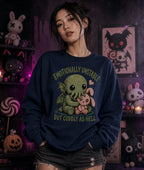 Emotionally unstable Cthulhu hugging a pink bunny on a navy sweatshirt, modeled indoors with plush toys and Halloween décor in the background.