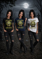 Three women stand in a moonlit graveyard wearing black, navy, and white T‑shirts with zombie graphics and coffee text.