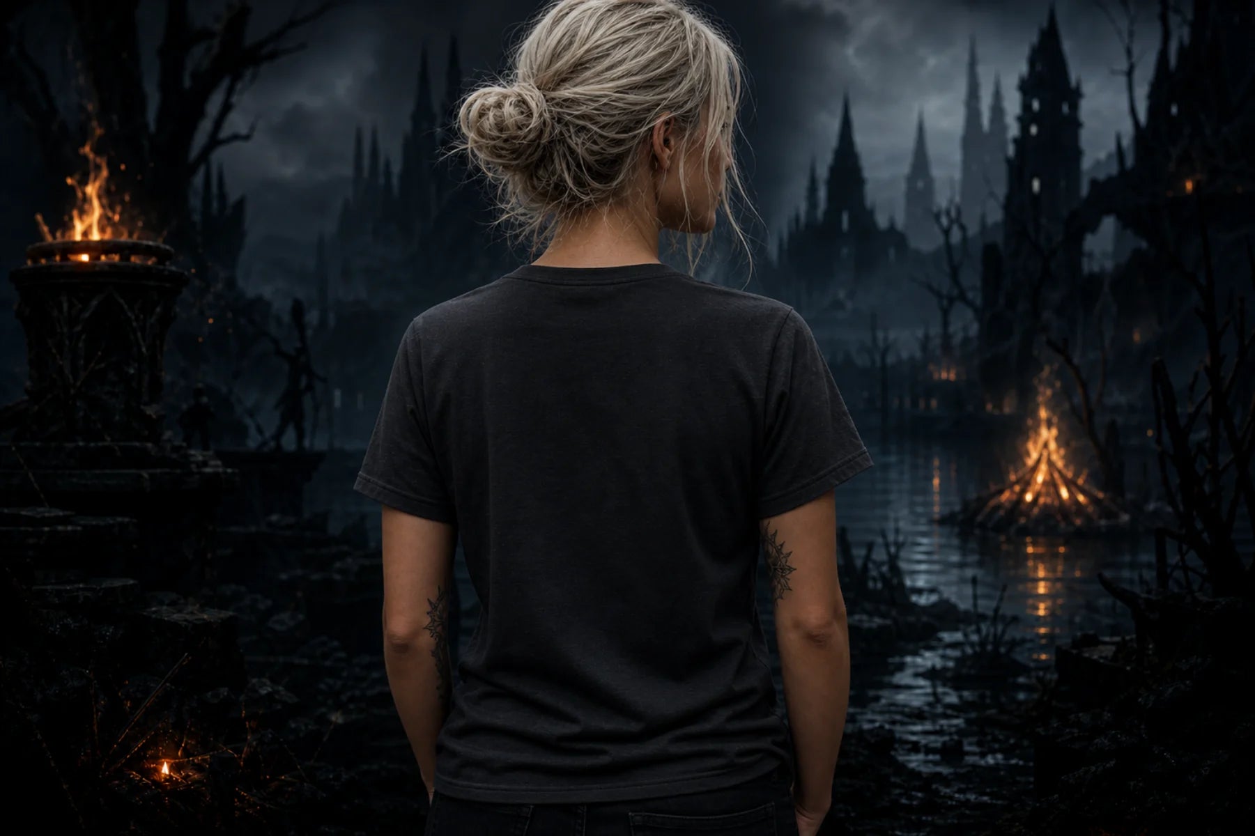 Person seen from behind in a plain black tee standing in a dark gothic scene with campfire, water, mist and distant spires