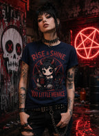 Person in punk outfit wearing chibi horror T‑shirt, standing in dark graffiti scene with red neon symbol and gothic décor