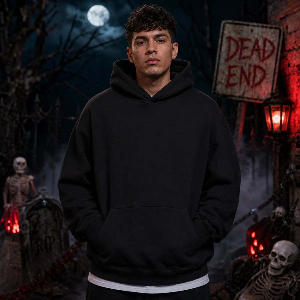 Person wearing a black hoodie in a spooky graveyard scene with skeletons, fog, full moon, tombstones and a red lantern glow